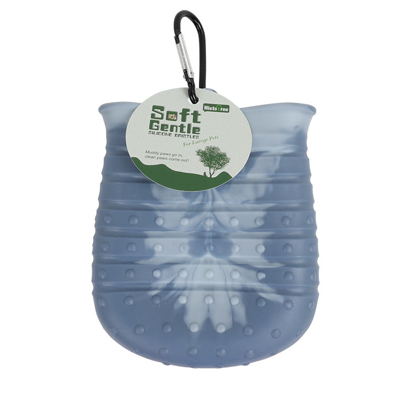 Clean paw lifted out; PawPure cup clips to a bag with its carabiner